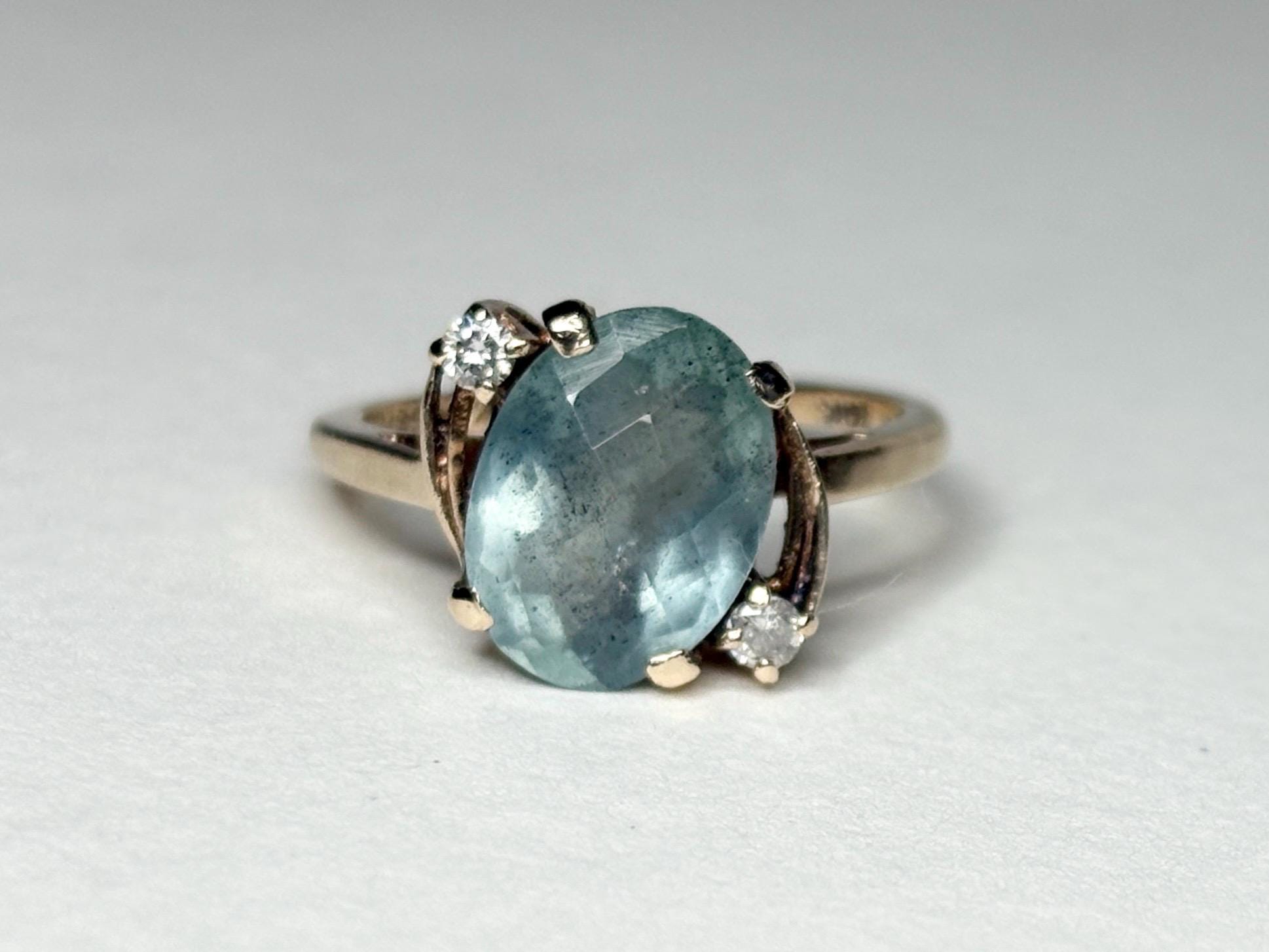 Vintage 10k gold ring with oval seafoam aquamarine and two small diamonds.