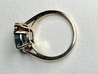 Vintage 10k gold ring with a seafoam blue-green aquamarine beryl and natural diamonds.