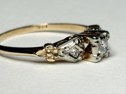 Vintage two-tone 14k gold ring with three diamonds and orange blossom details.