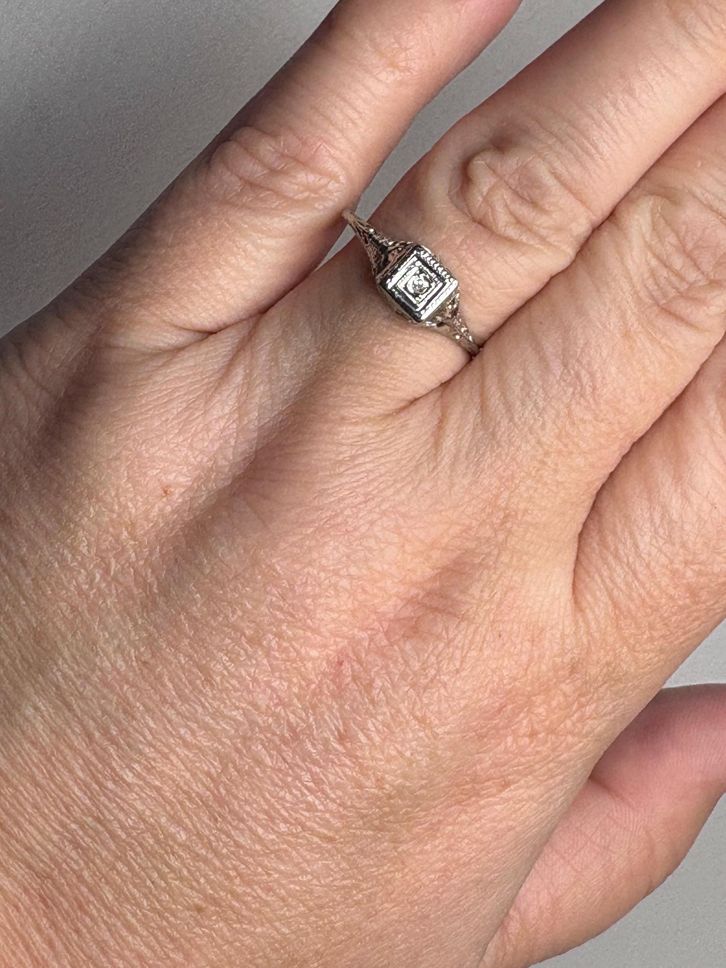 Art Deco 18k gold filigree ring with an old mine cut diamond.