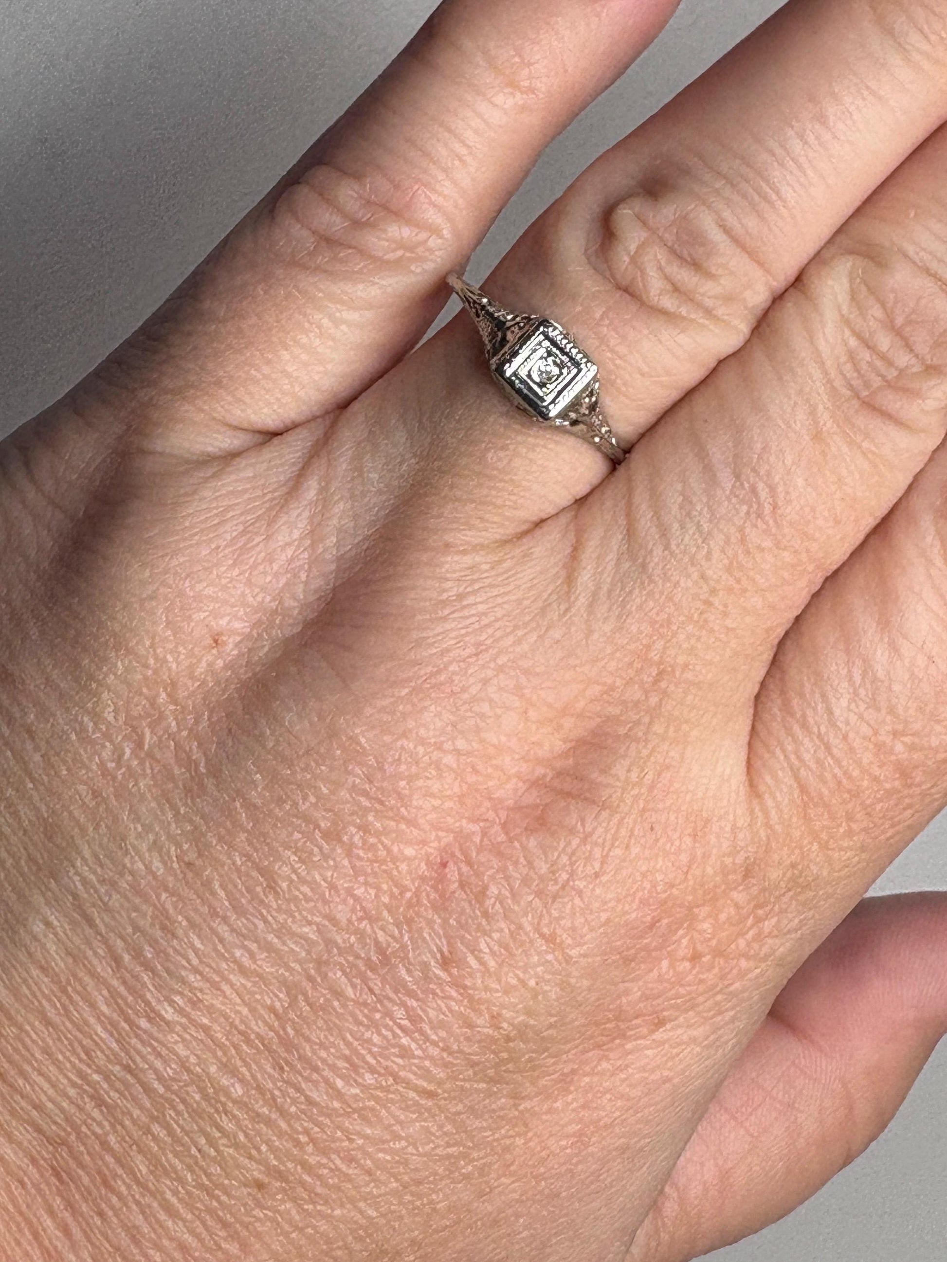 Art Deco 18k gold filigree ring with an old mine cut diamond.