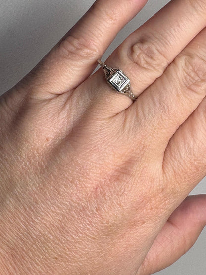 Art Deco 18k gold filigree ring with an old mine cut diamond.