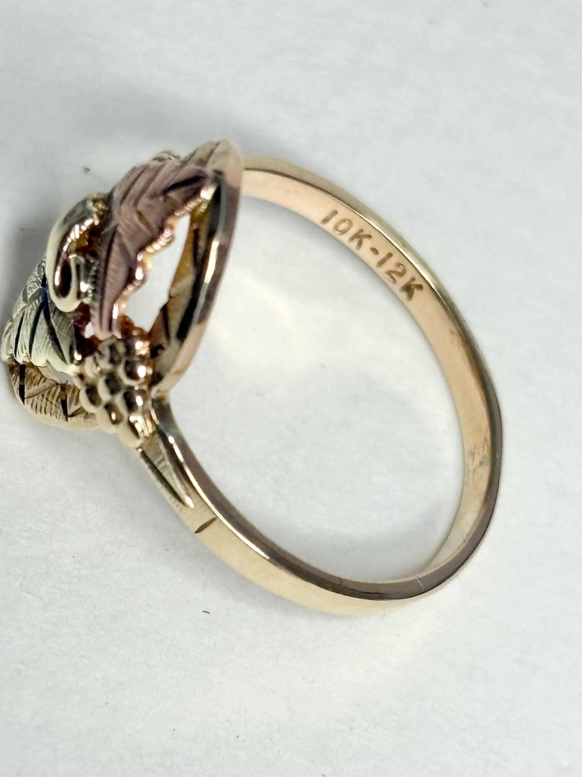 Black Hills Gold ring with 10k band and 12k leaves.