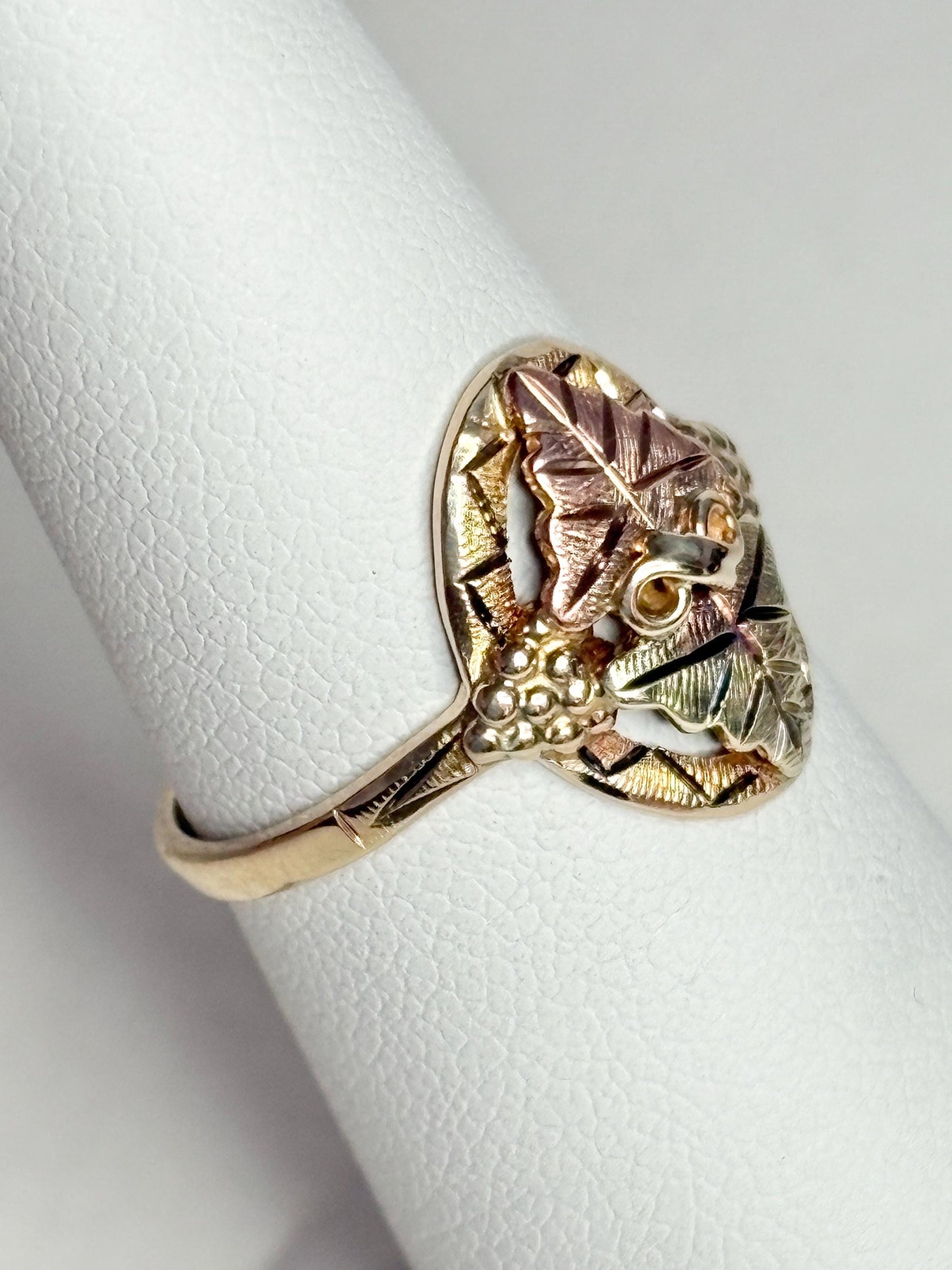 Black Hills Gold ring with 10k gold band and 12k gold leaves.