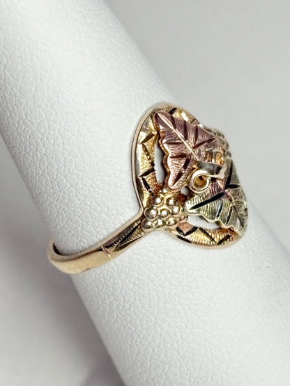 Black Hills Gold ring with 10k gold band and 12k gold leaves.