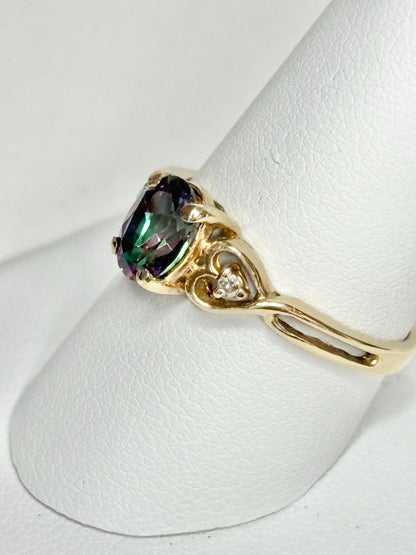 10k yellow gold ring with mystic topaz and two diamonds.