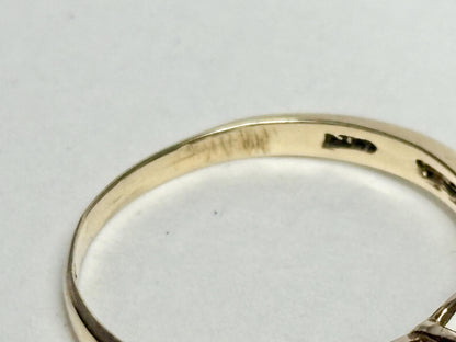 A solid 10k yellow gold ring with a mystic topaz and diamond heart design.