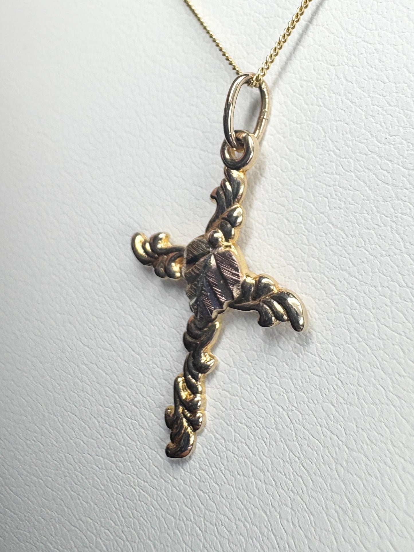 Black Hills Gold 10k gold cross pendant on an 18" 9k gold chain.