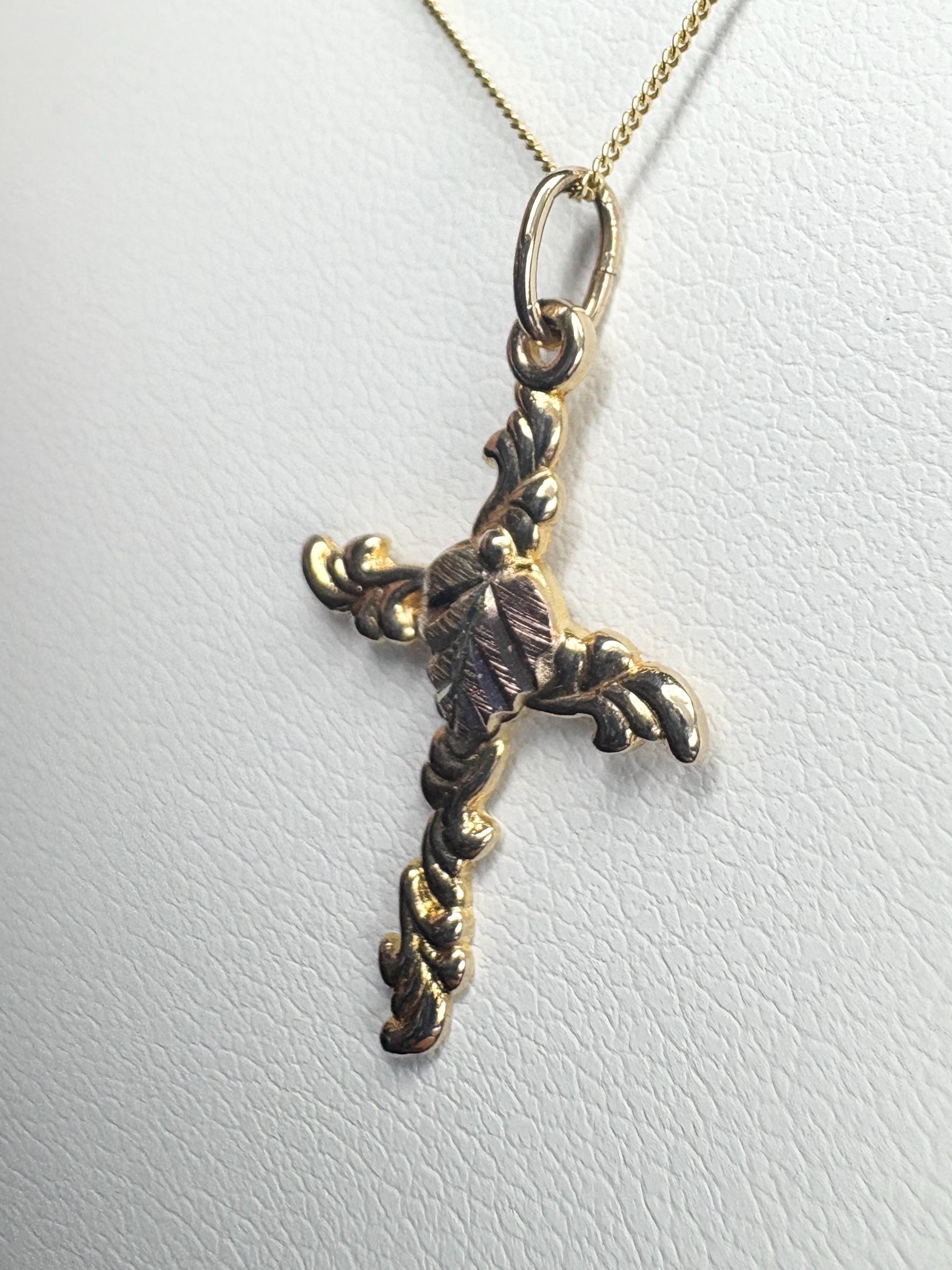 Black Hills Gold 10k gold cross pendant on an 18" 9k gold chain.