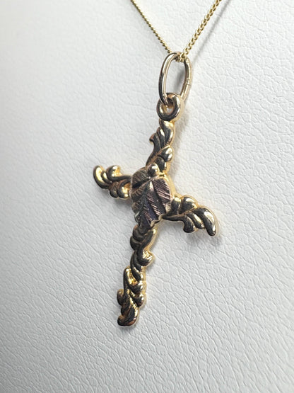 Black Hills Gold 10k gold cross pendant on an 18" 9k gold chain.