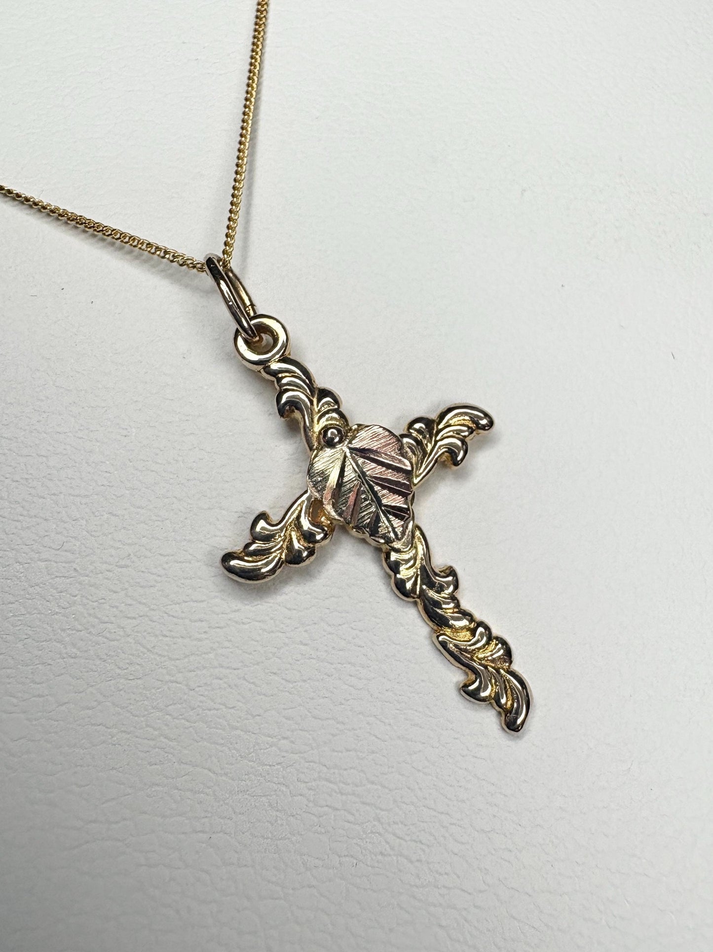 Black Hills Gold cross pendant necklace in 10k gold on an 18" 9k gold chain.