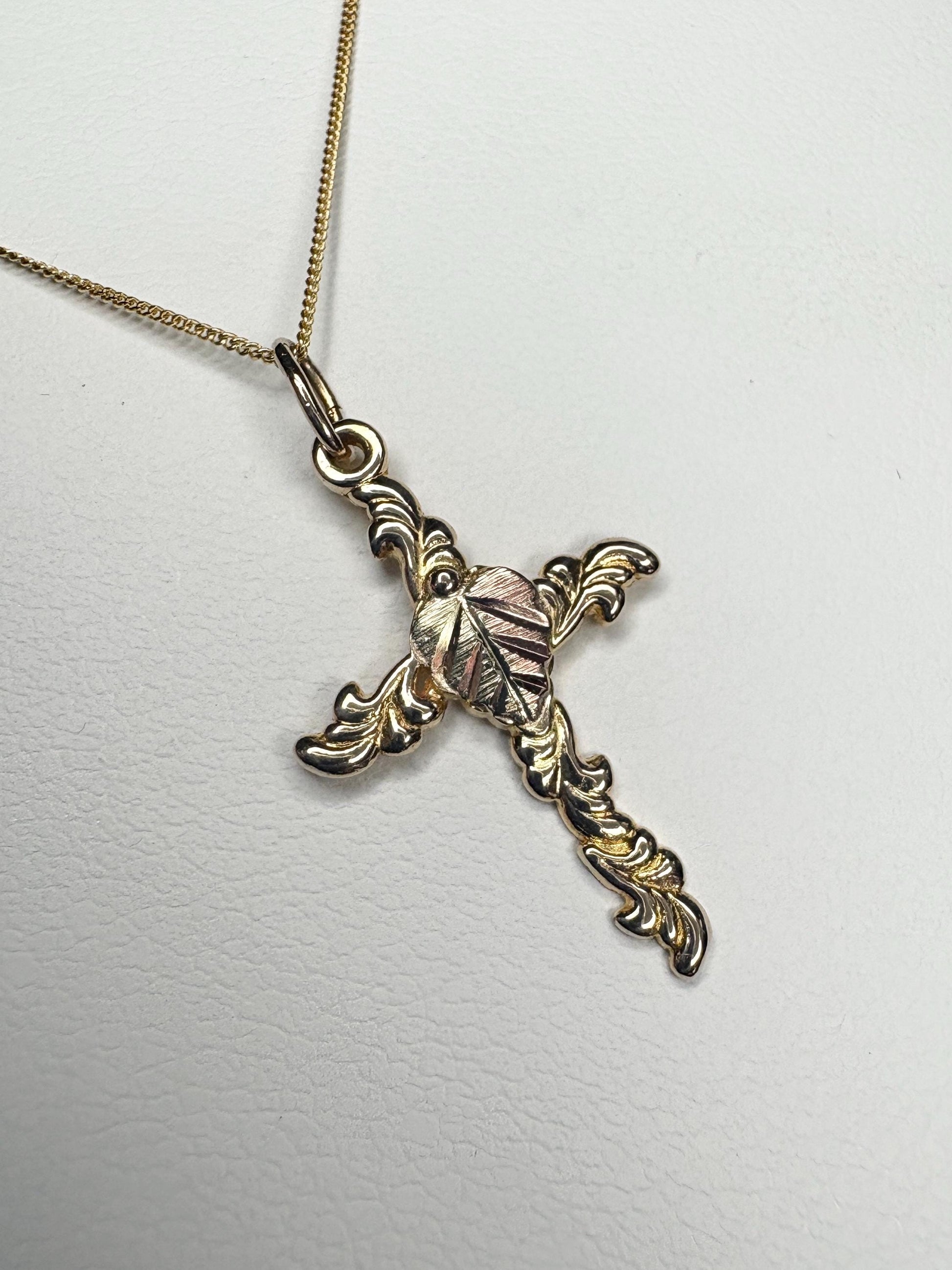 Black Hills Gold cross pendant necklace in 10k gold on an 18" 9k gold chain.