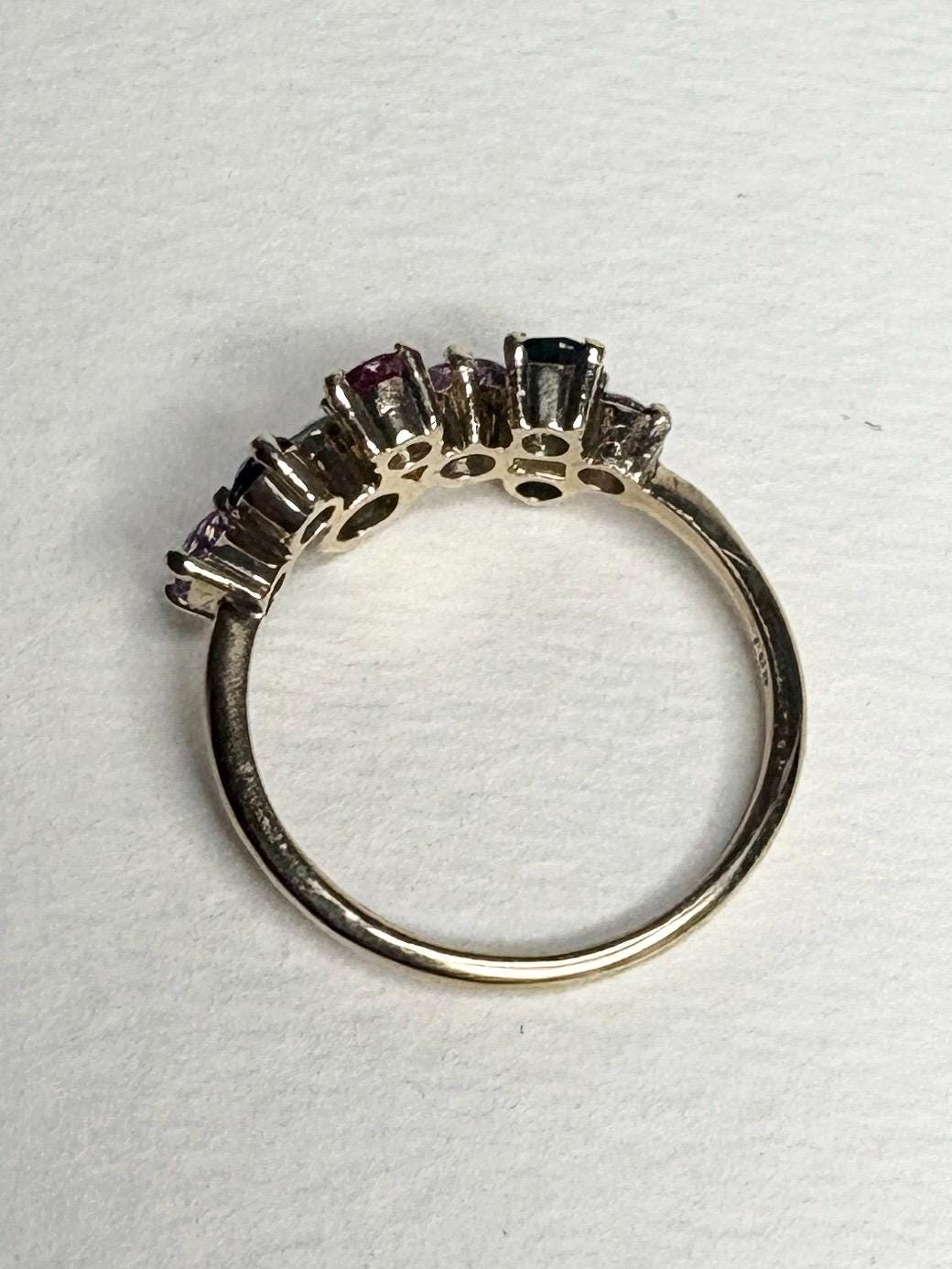 A 10k gold ring with multiple colored sapphires.