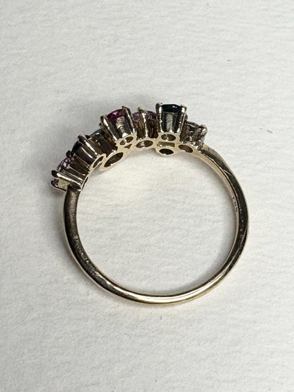 A 10k gold ring with multiple colored sapphires.