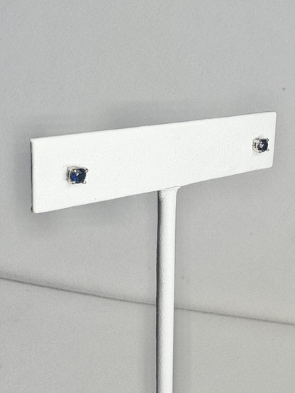 Natural dark blue sapphire stud earrings in solid 14k white gold.