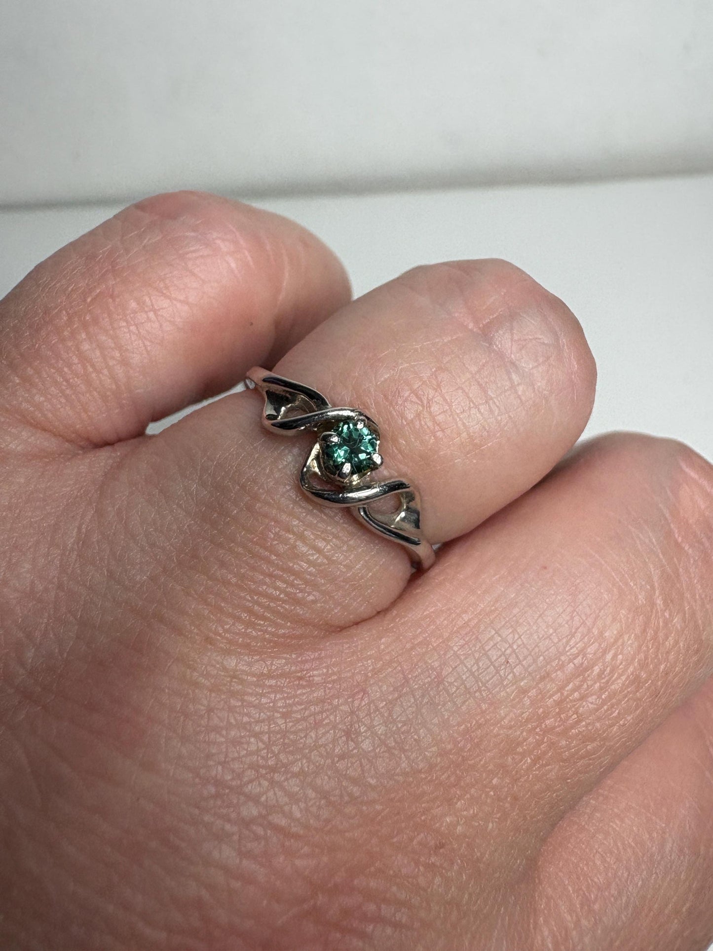 Lagoon blue-green tourmaline band ring in 10k white gold.