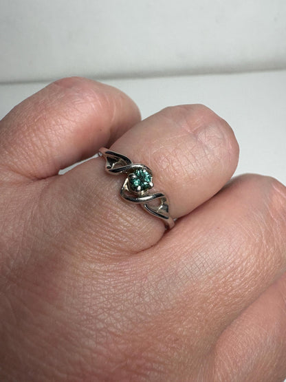Lagoon blue-green tourmaline band ring in 10k white gold.
