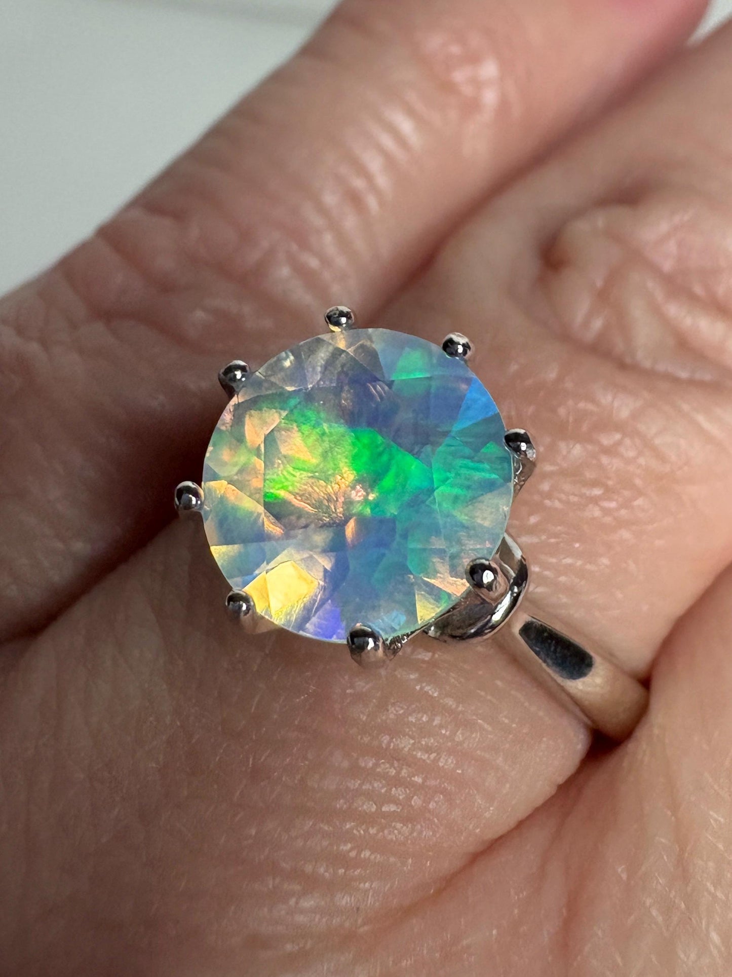 Sterling silver ring with a faceted Ethiopian crystal opal.