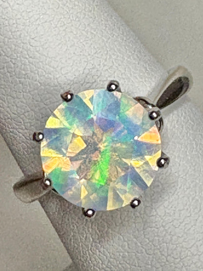 A faceted crystal opal ring in sterling silver.