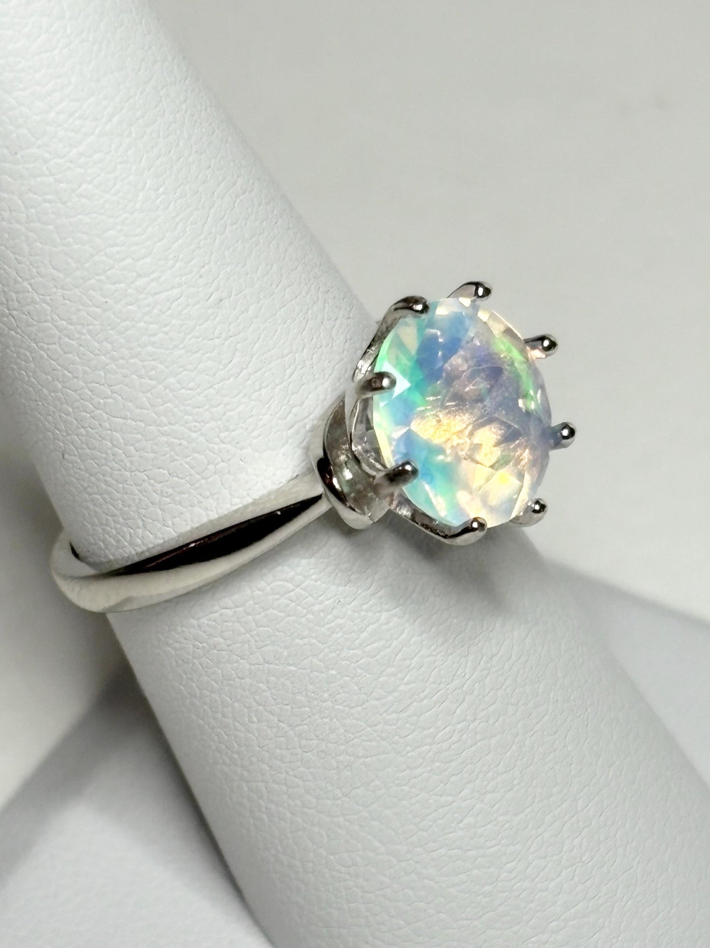 Sterling silver ring with a faceted Ethiopian crystal opal.