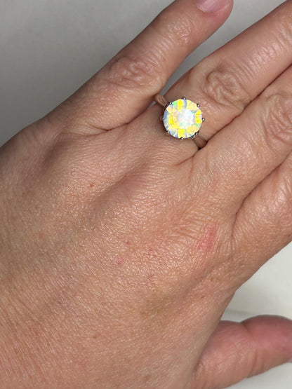 Faceted Ethiopian crystal opal solitaire ring in sterling silver.