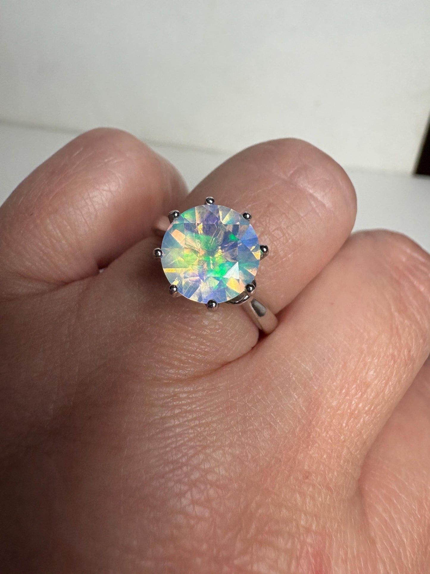 Sterling silver ring with a faceted Ethiopian crystal opal.