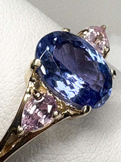 Oval tanzanite and pear pink sapphire ring in 9k gold.