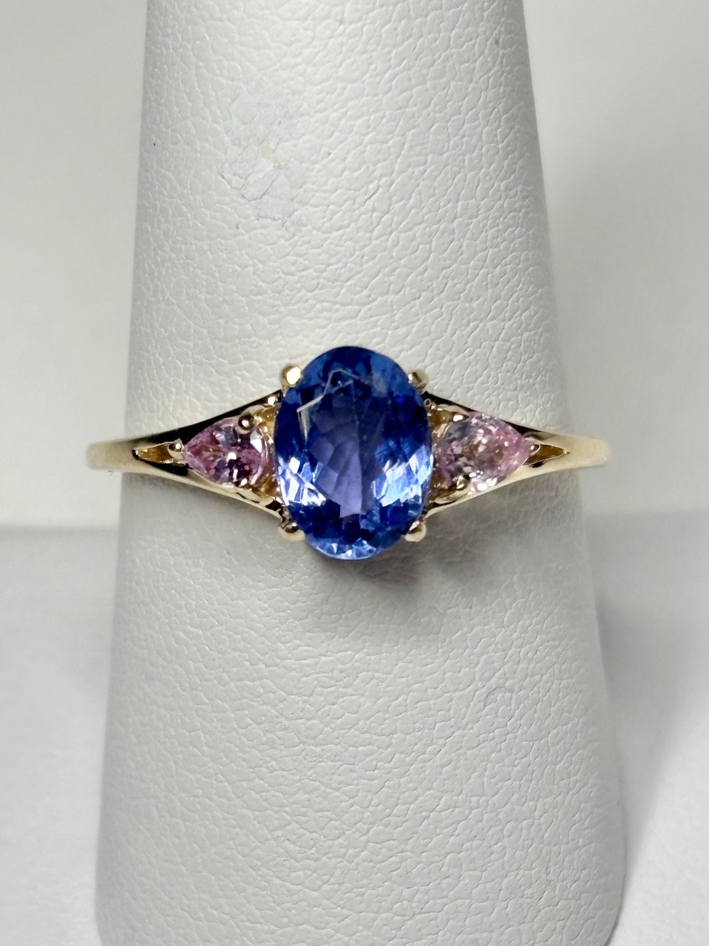 Oval tanzanite and pear pink sapphire ring in 9k gold.