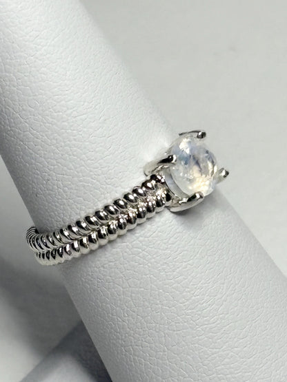 Sterling silver ring with a rainbow moonstone and double rope band.