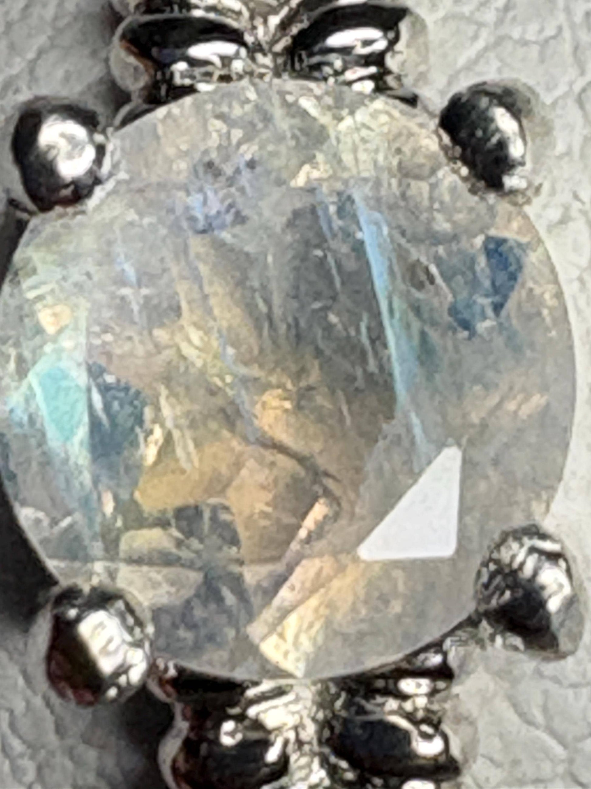 Sterling silver ring with a round rainbow moonstone and double rope band.