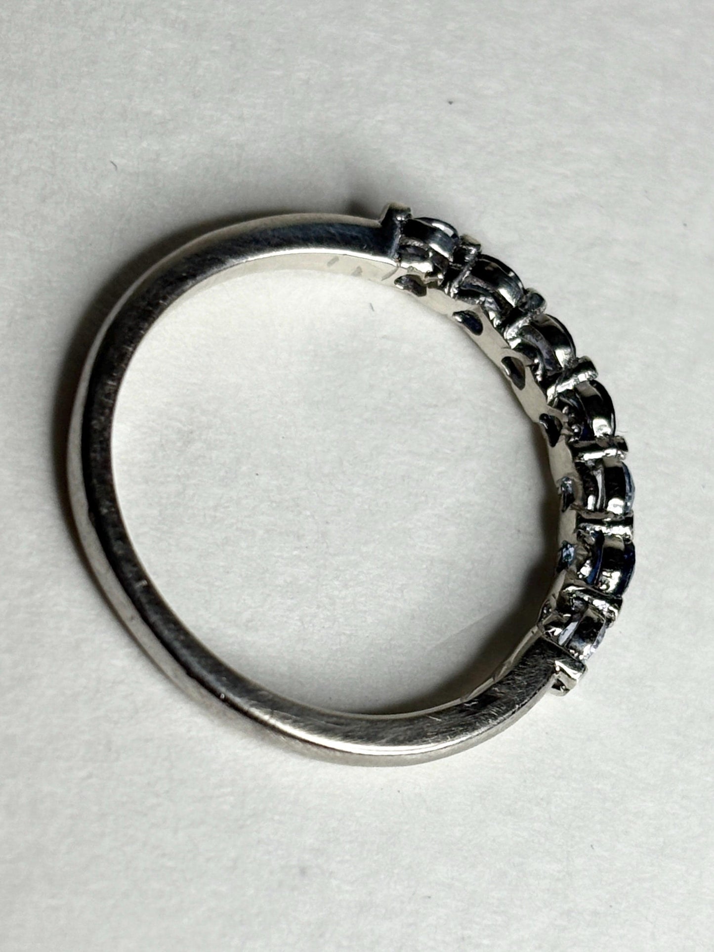 Sterling silver stackable band ring with blue and light blue sapphires.