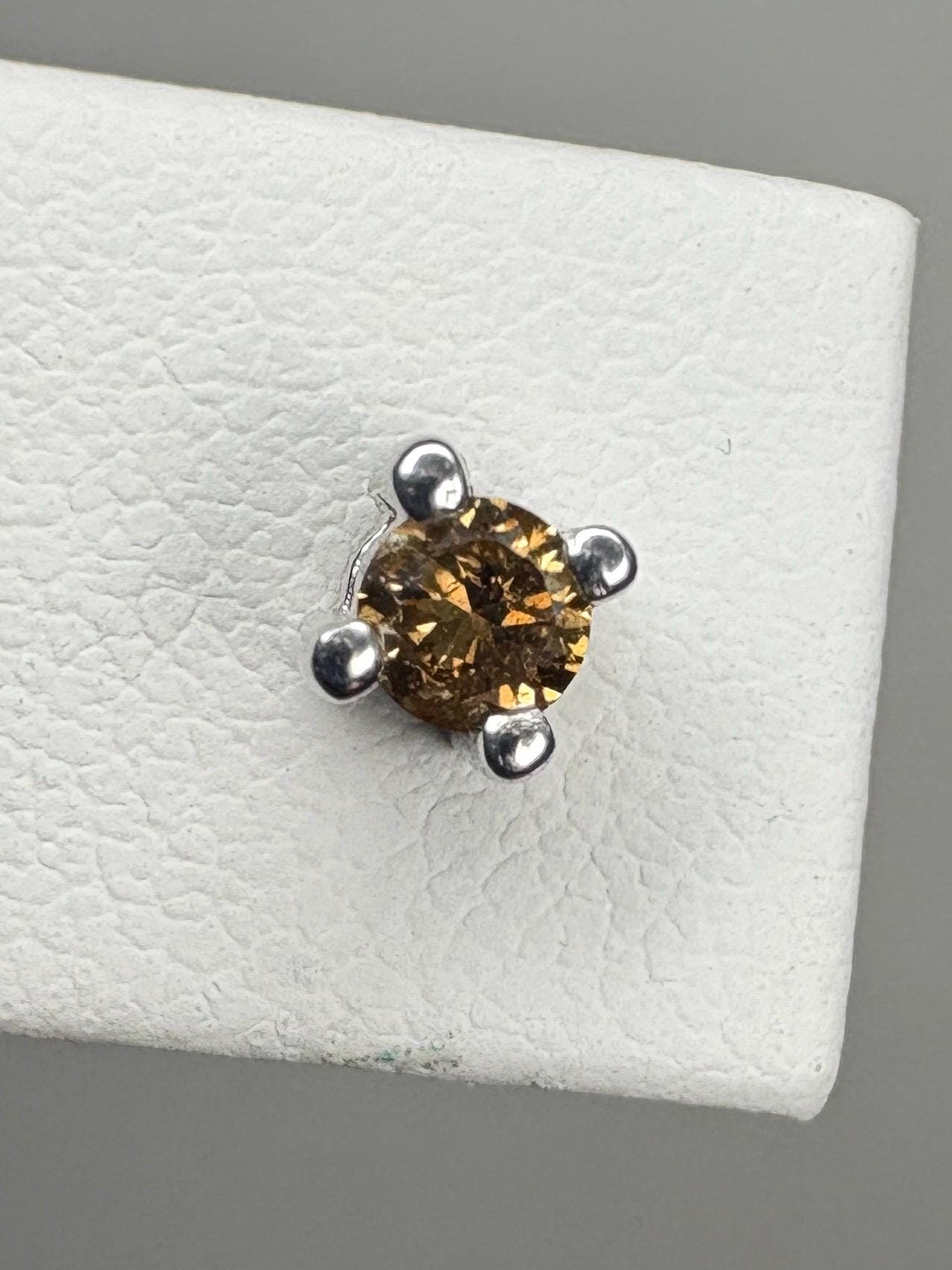 Sterling silver stud earrings with a 3mm chocolate champagne colored diamond.