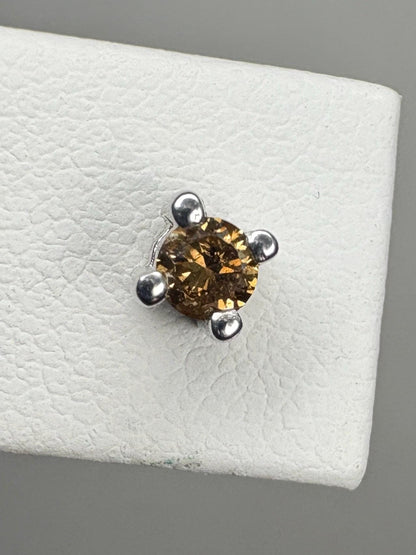 Sterling silver stud earrings with a 3mm chocolate champagne colored diamond.