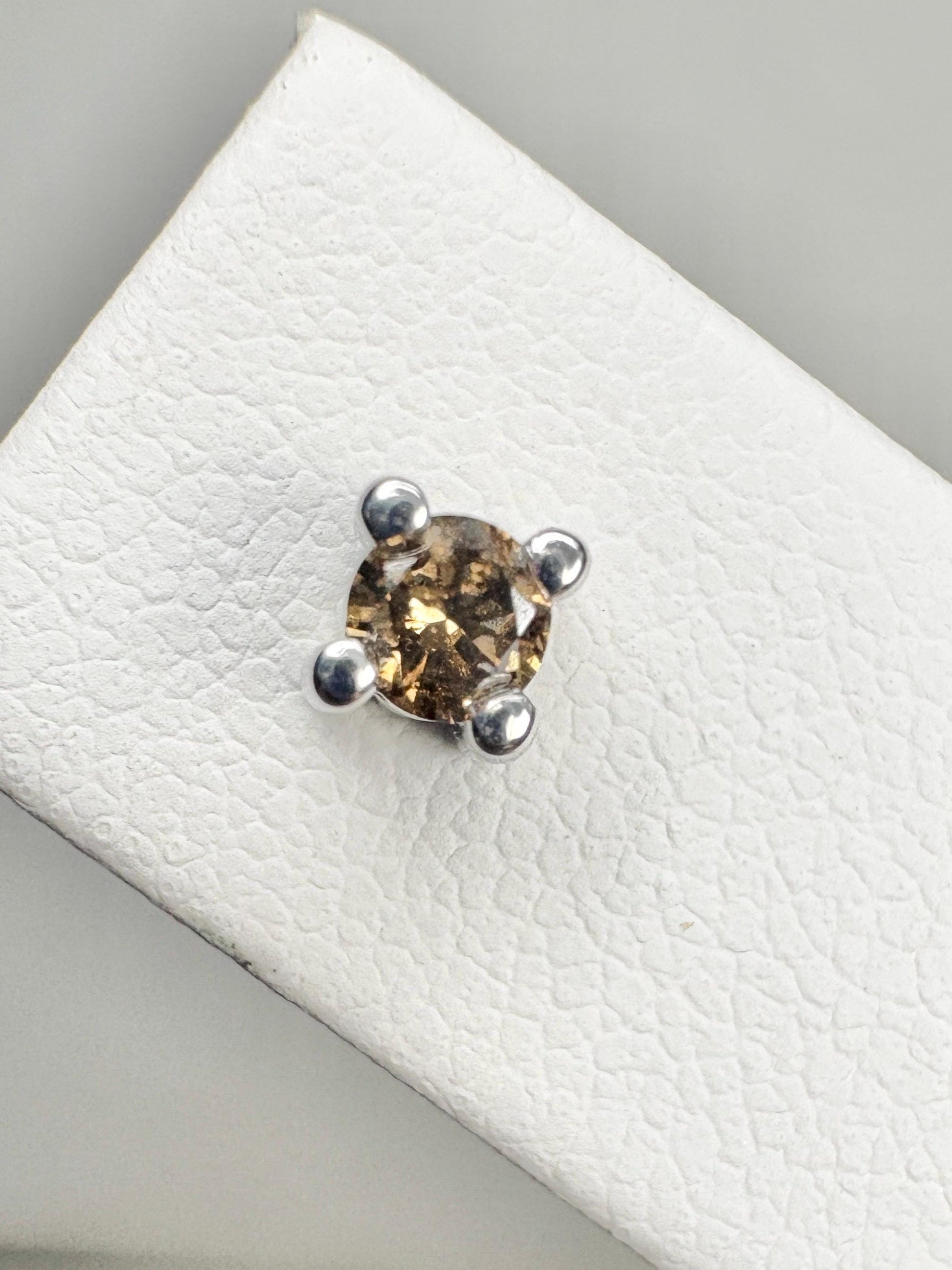 Sterling silver stud earrings with 3mm chocolate champagne colored natural diamonds.