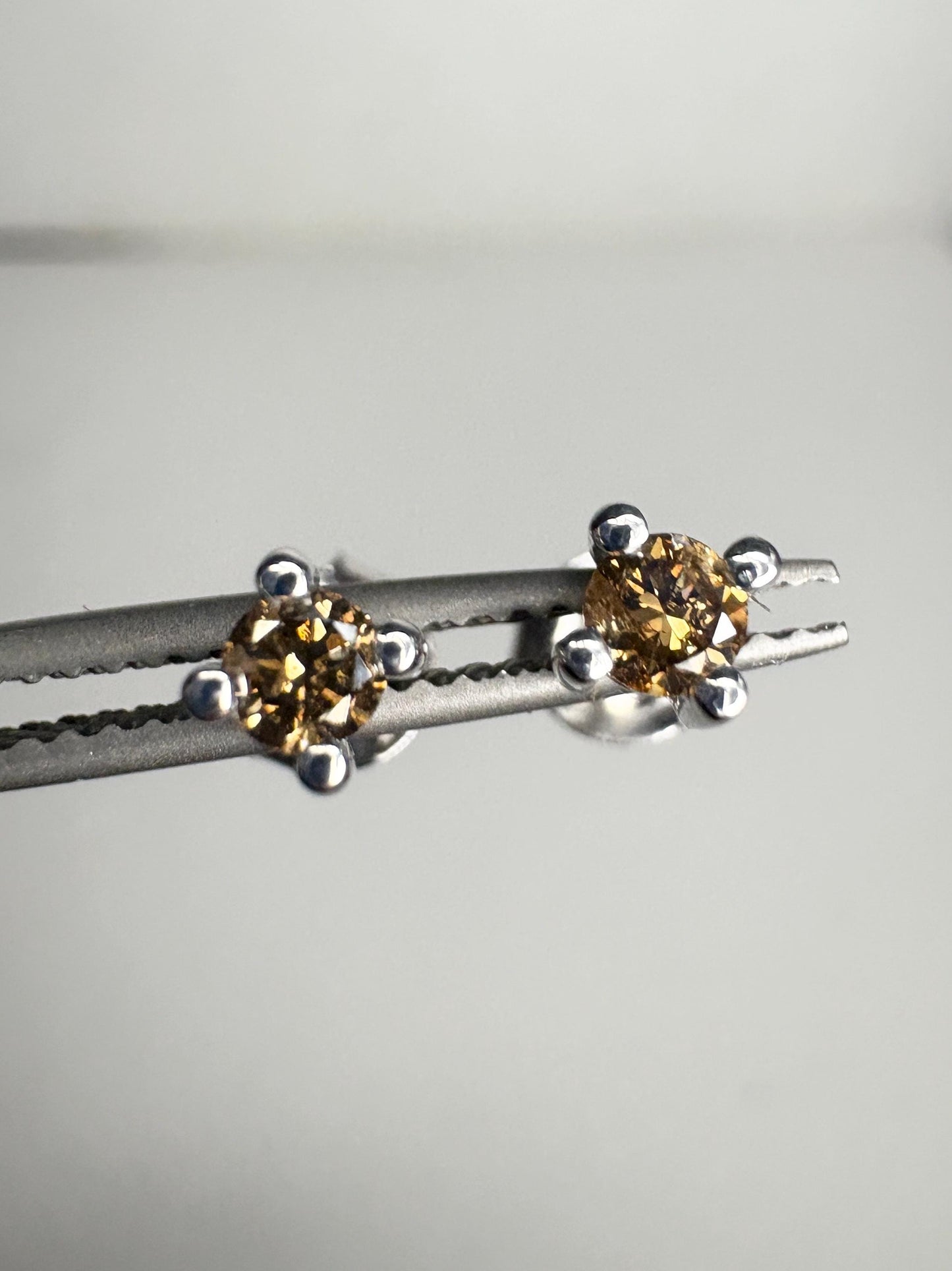 Sterling silver stud earrings with 3mm chocolate champagne colored natural diamonds.