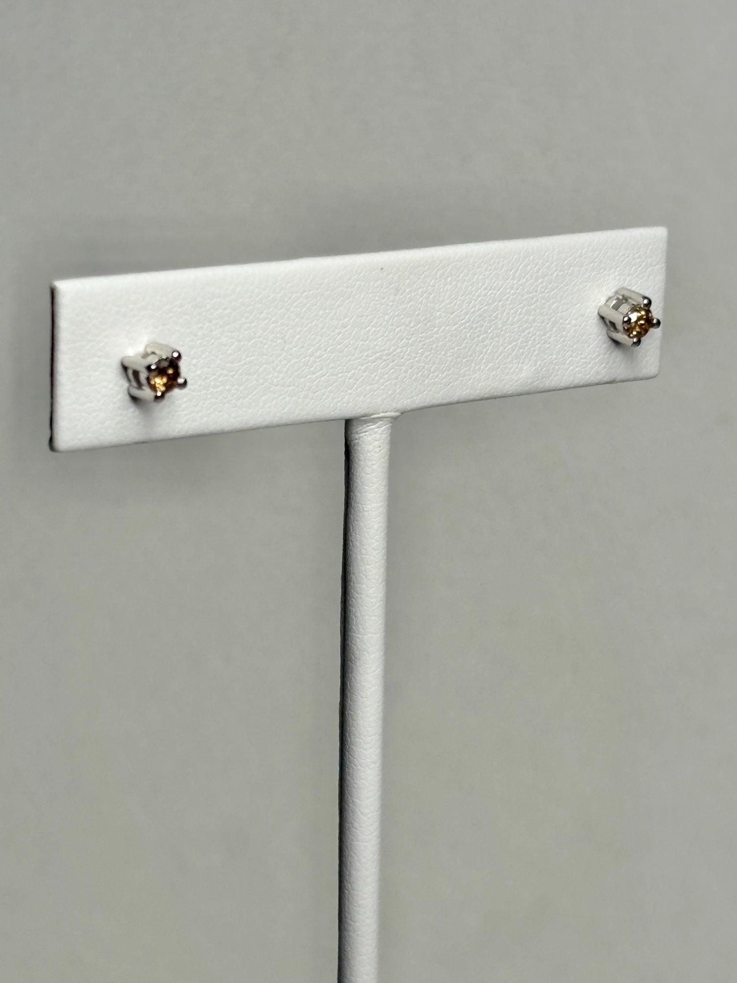 Sterling silver stud earrings with 3mm chocolate champagne colored natural diamonds.
