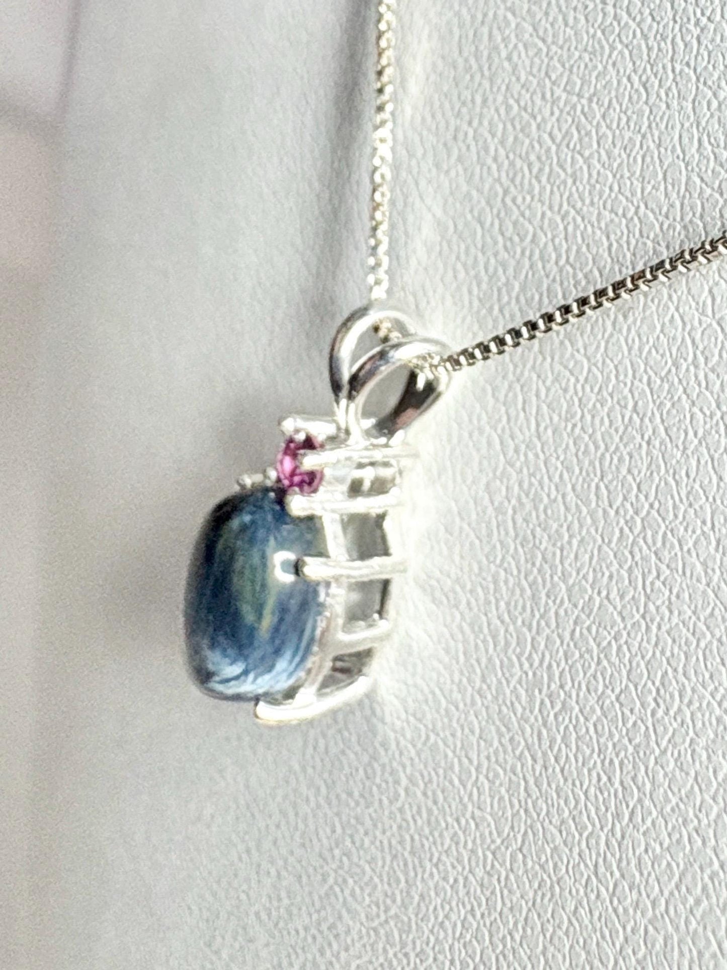 Sterling silver pendant necklace with African blue pietersite and rhodolite garnet.