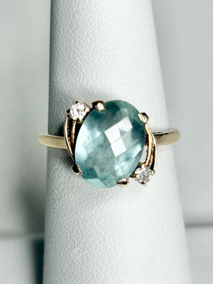 Vintage 10k gold ring with oval seafoam aquamarine and two diamonds.