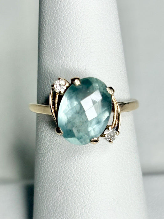 Vintage 10k gold ring with oval seafoam aquamarine and two diamonds.