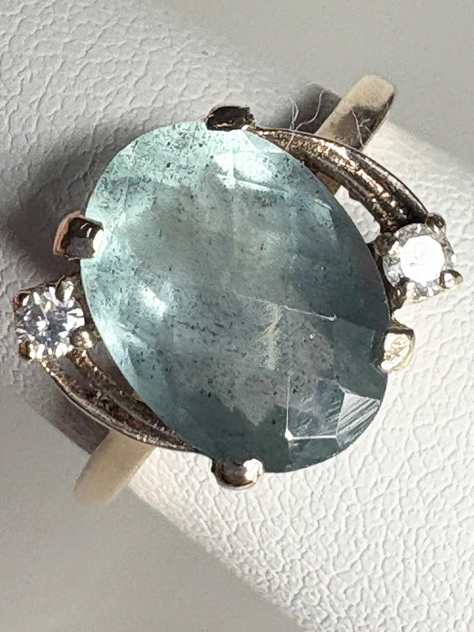 Vintage 10k gold ring with an oval seafoam aquamarine and two small diamonds.