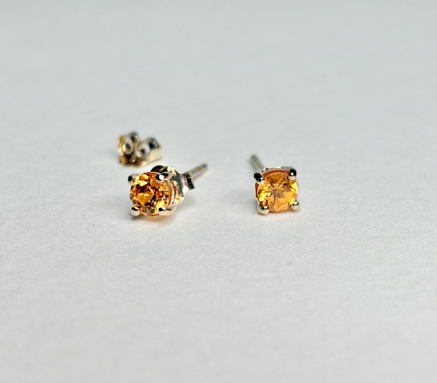 Spessartite garnet stud earrings in solid 9k gold.