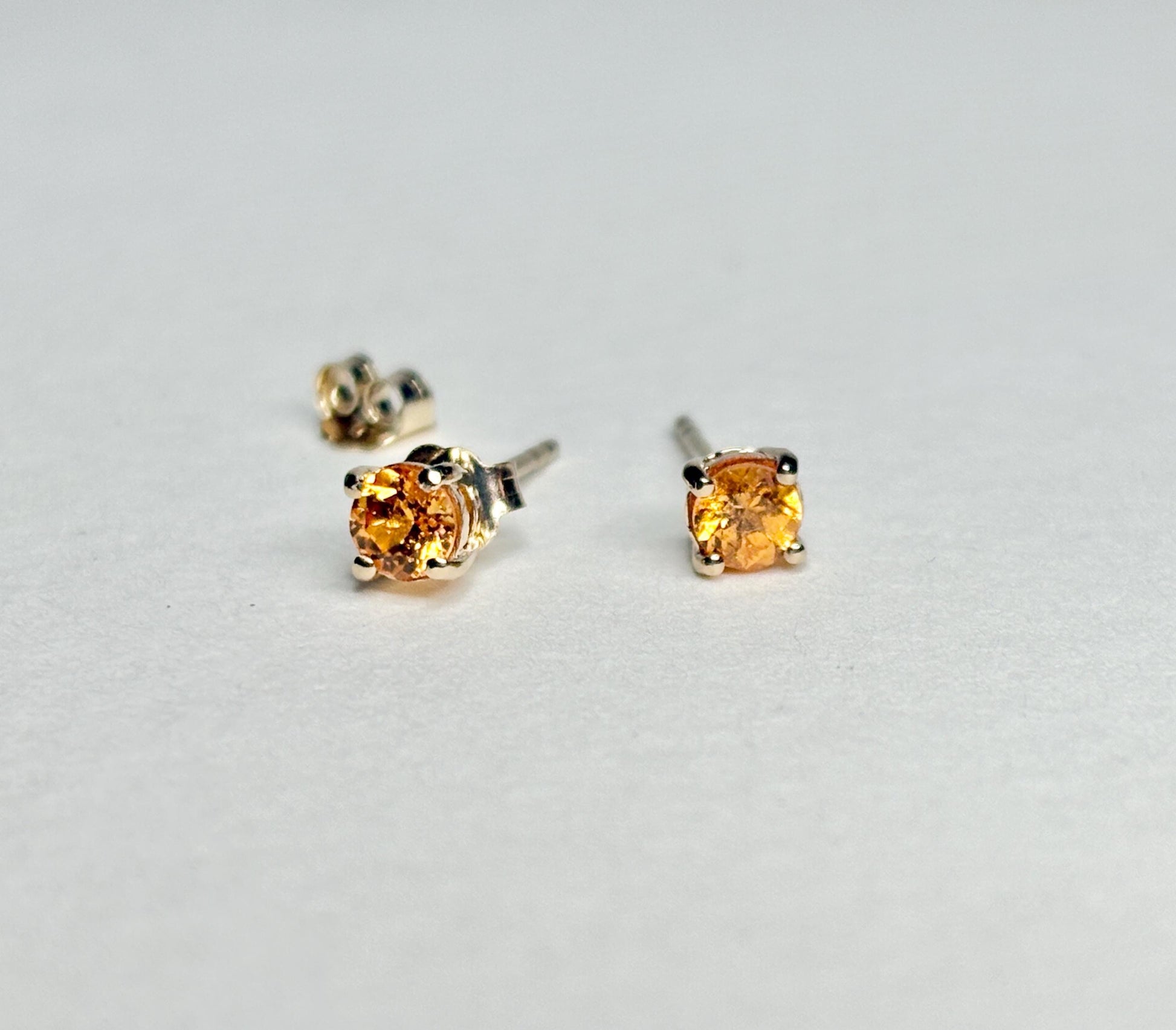 Spessartite garnet stud earrings in solid 9k gold.