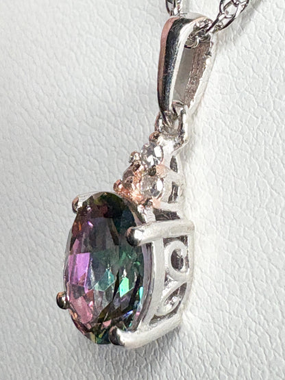 Sterling silver pendant with oval mystic topaz and lab-grown diamonds on an 18" rope chain.
