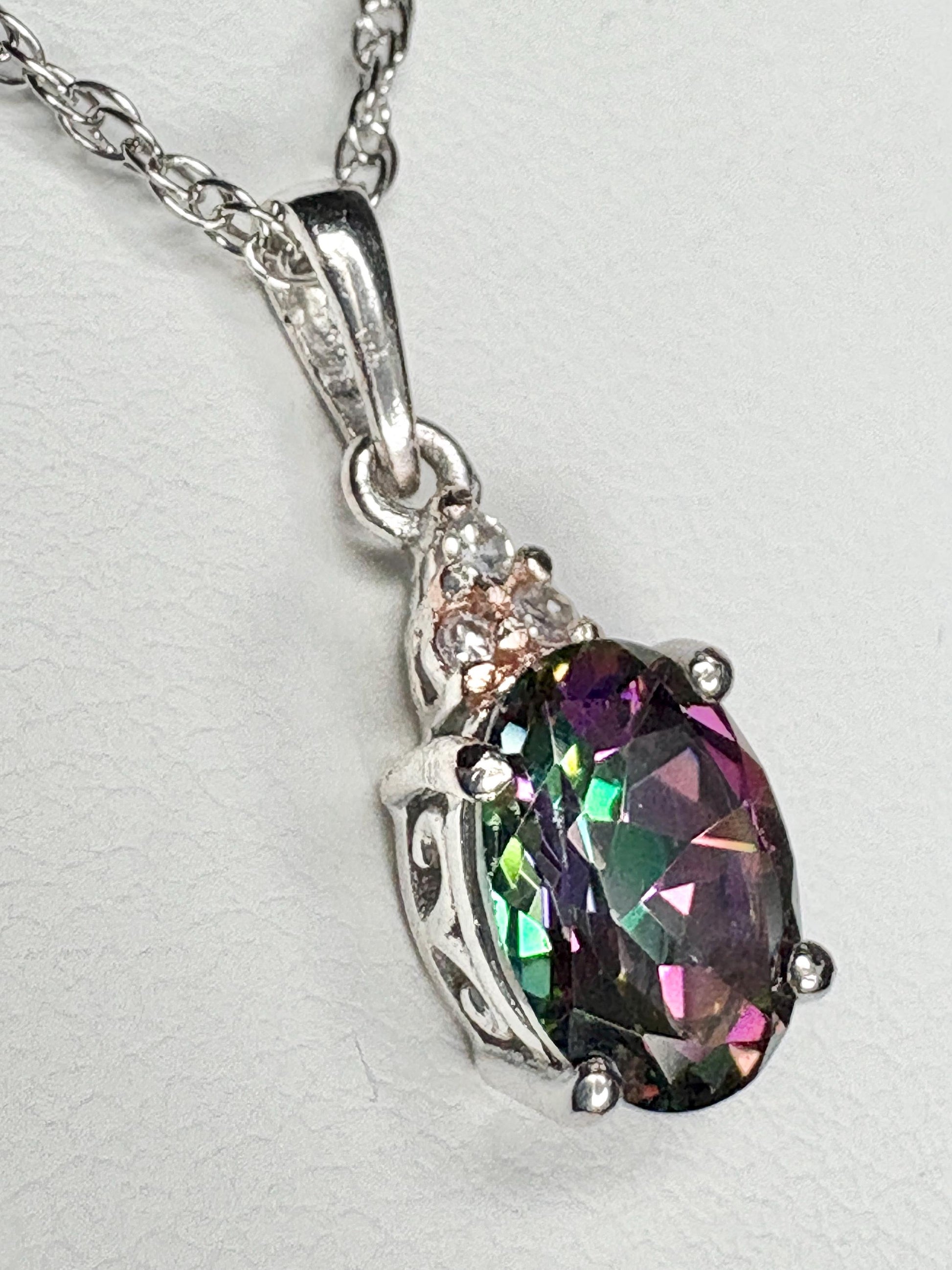 Sterling silver pendant necklace with oval mystic topaz and lab-grown diamonds.