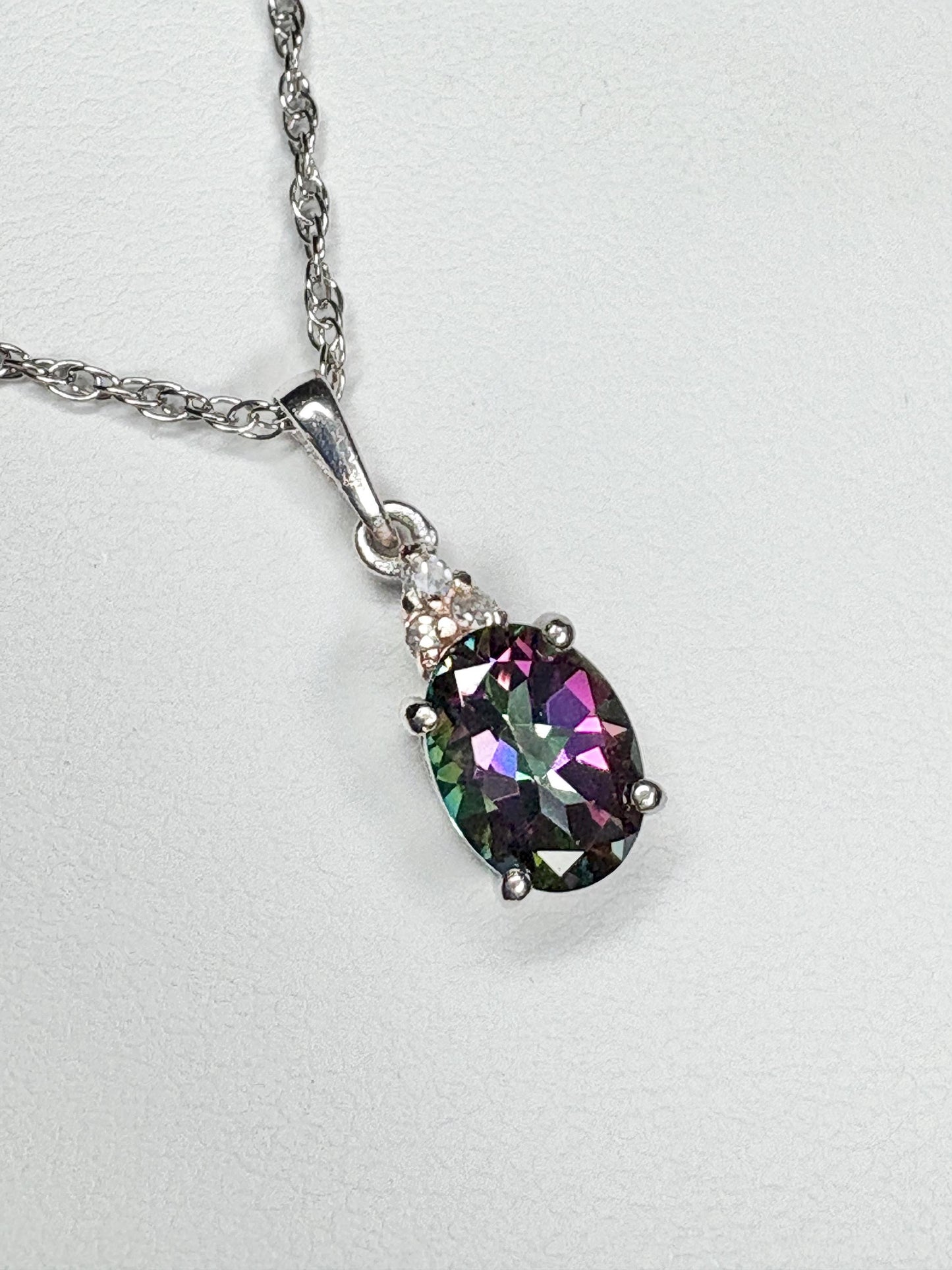 Sterling silver pendant necklace with oval mystic topaz and lab-grown diamonds.