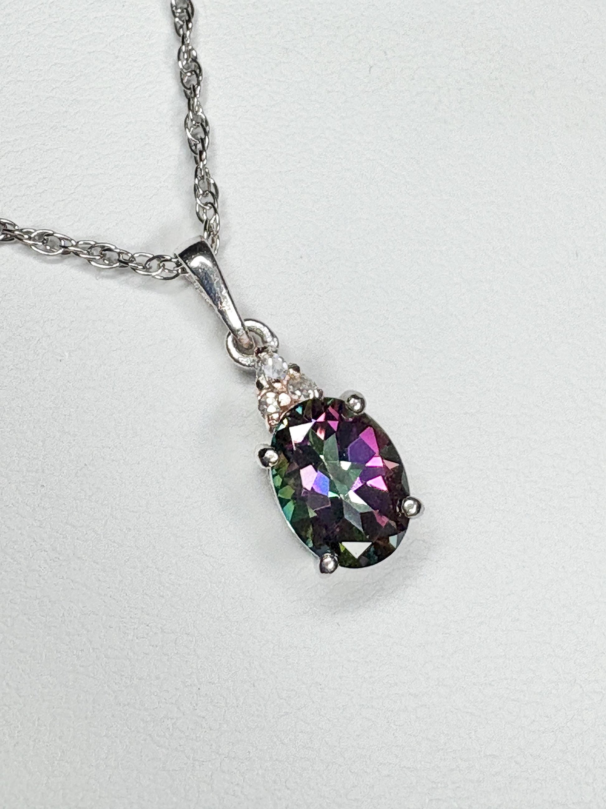 Sterling silver pendant necklace with oval mystic topaz and lab-grown diamonds.