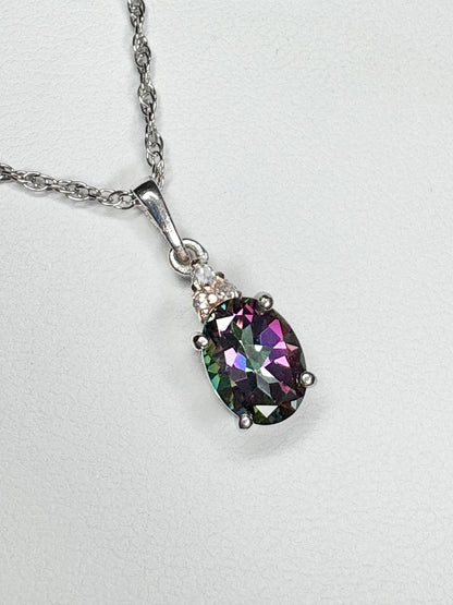 Sterling silver pendant necklace with oval mystic topaz and lab-grown diamonds.