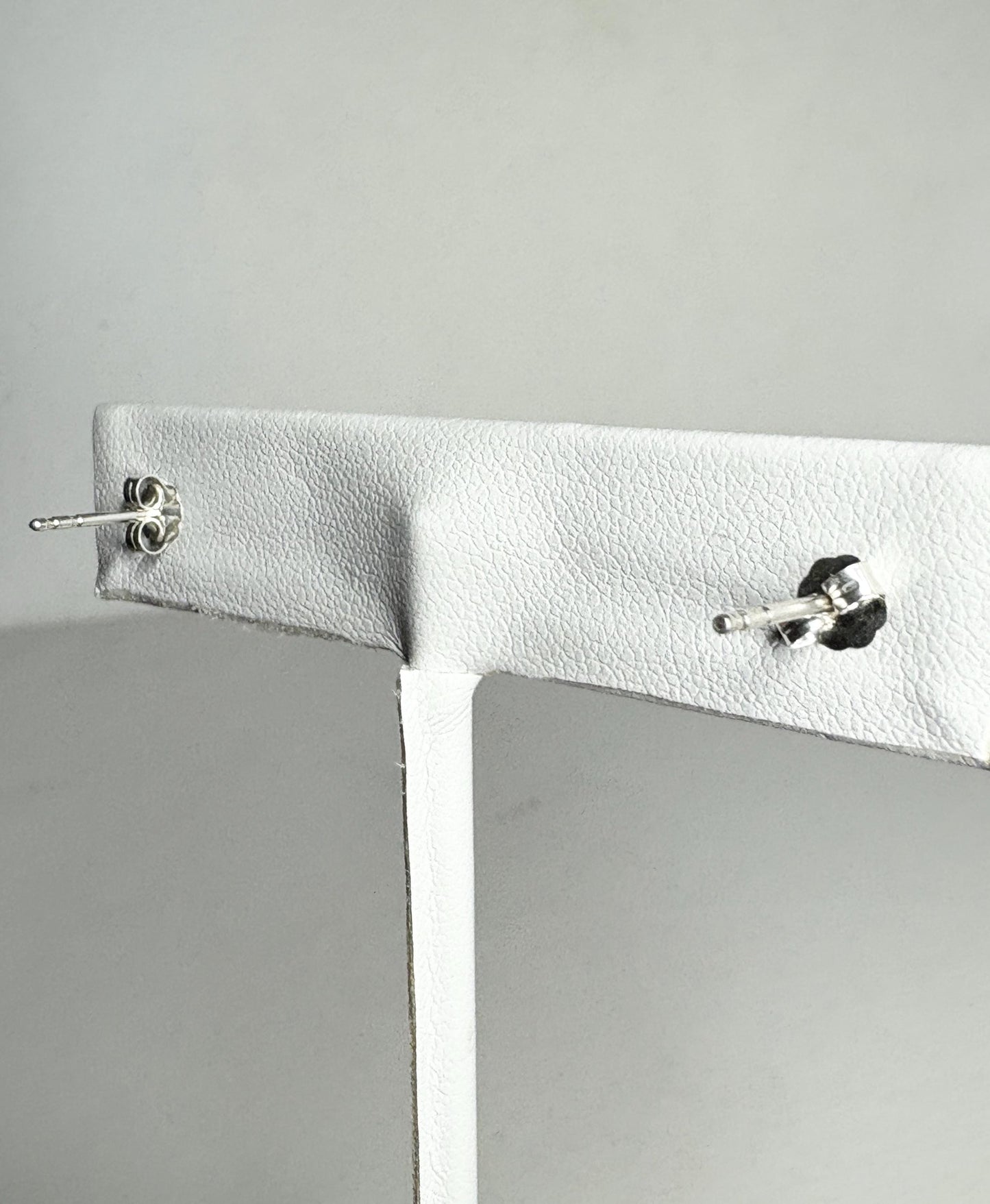 Sterling silver stud earrings with pear-shaped kyanite gems.