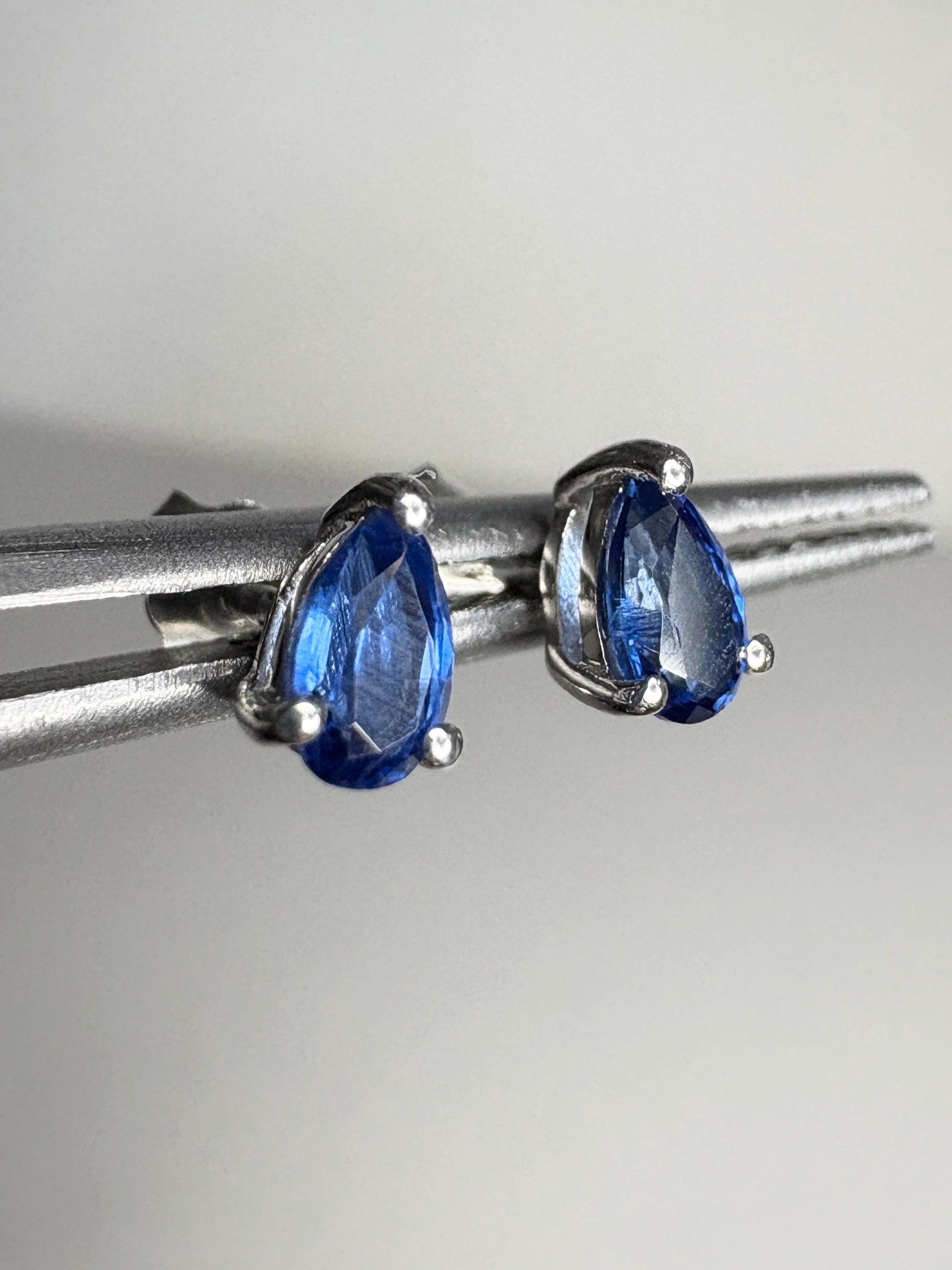 Kyanite stud earrings in pear shape, set in sterling silver.