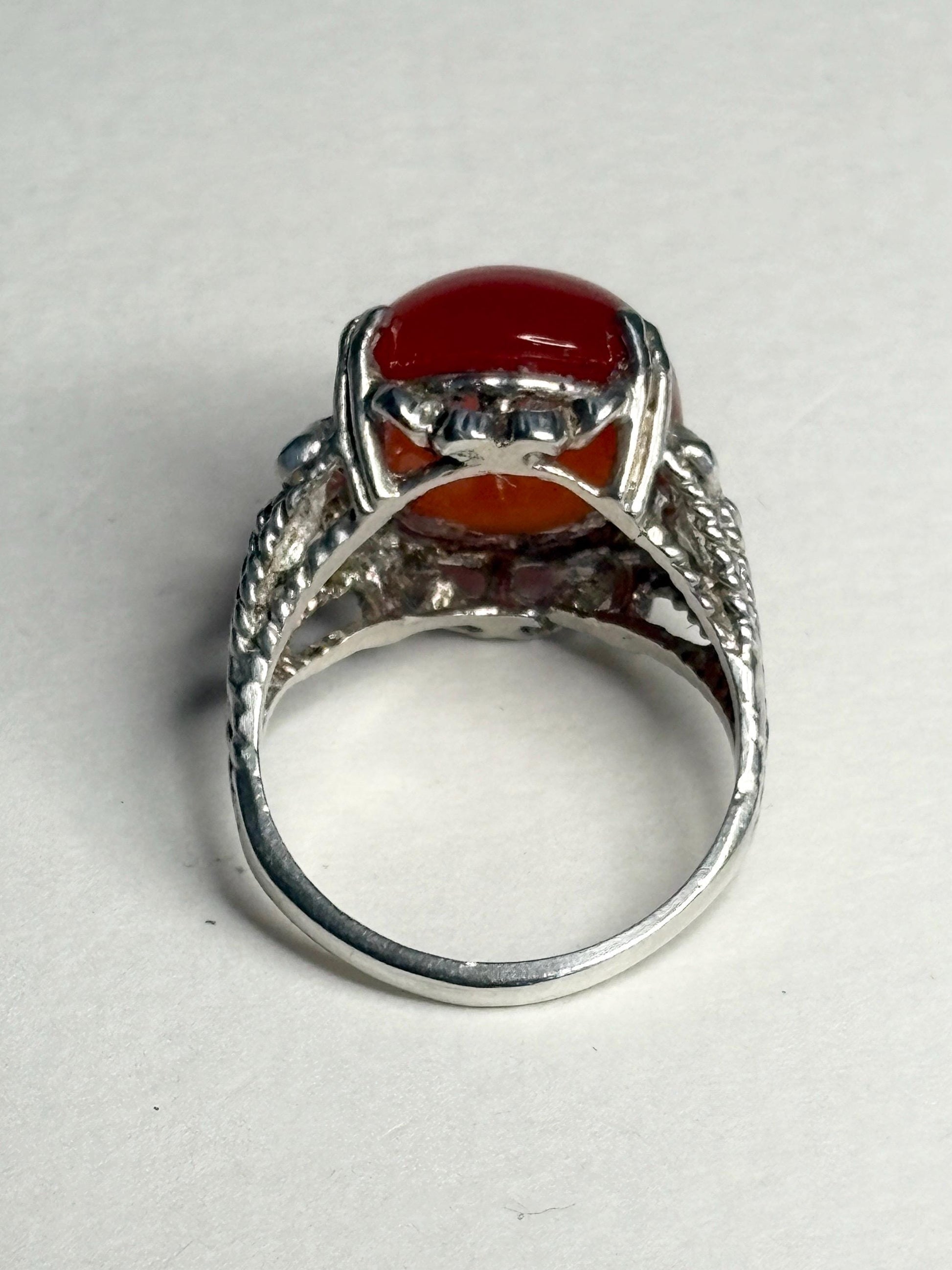 Sterling silver ring with a bold, oval carnelian cabochon.